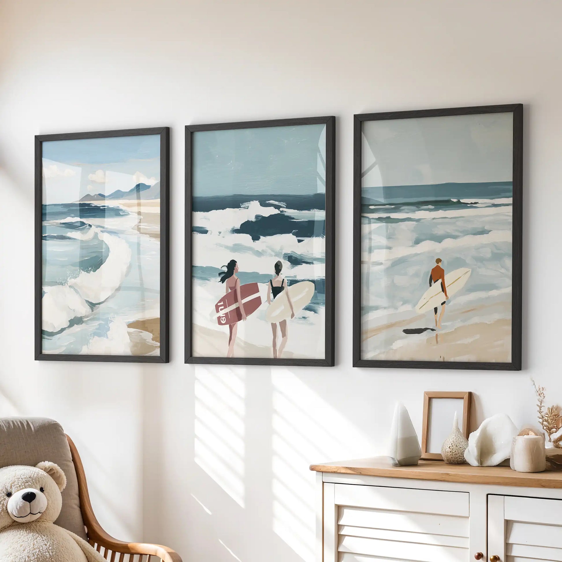 Seaside surf wall art set of three in black frames rests above a dresser, bringing a calm, ocean-inspired mood to the children’s room.