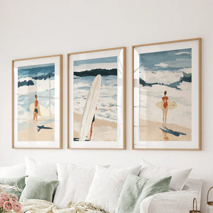 Coastal beach vistas, a three-piece wall hanging in natural wood frames with mats, grounds the sitting room above the couch.