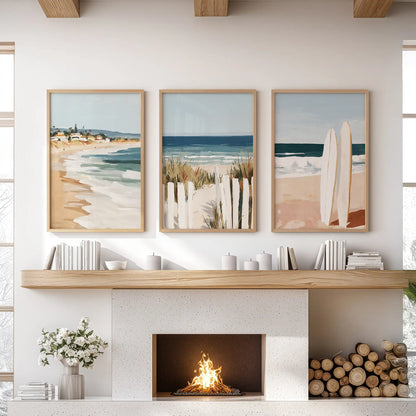 Thin wood-framed surfboard prints-three in the set-anchor the wall over the hearth, bringing an easy, surf-side mood to the living room.