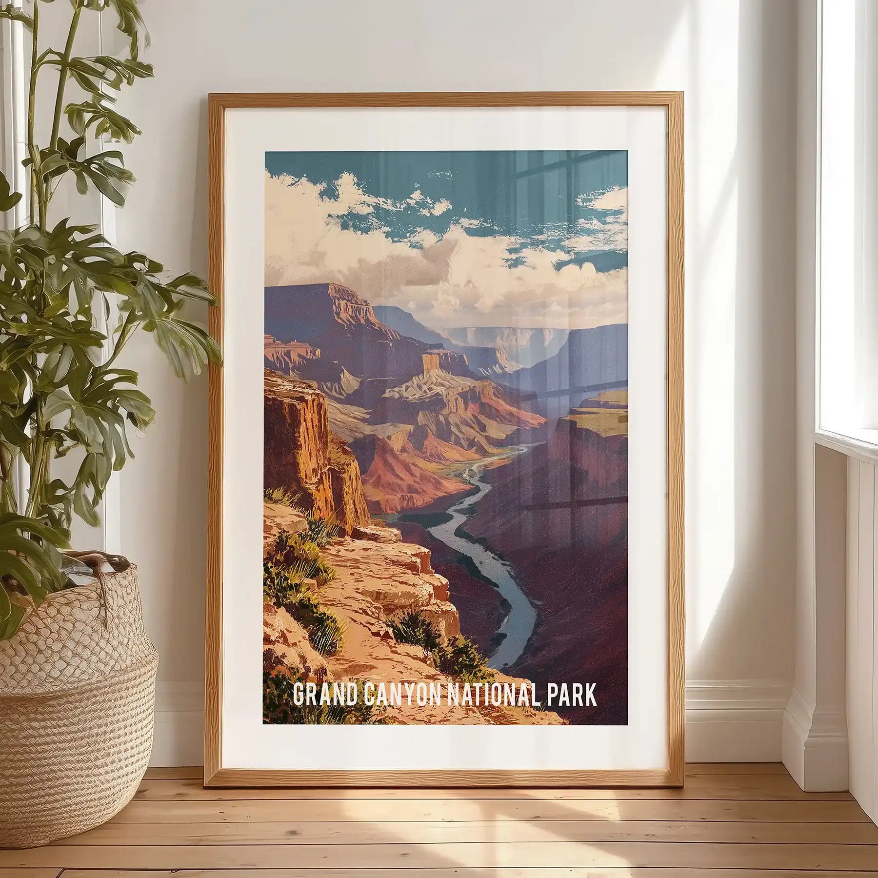 A Colorado River poster print with a black matted frame rests by the bedroom window, contrasting deep canyon tones against a pale sky.