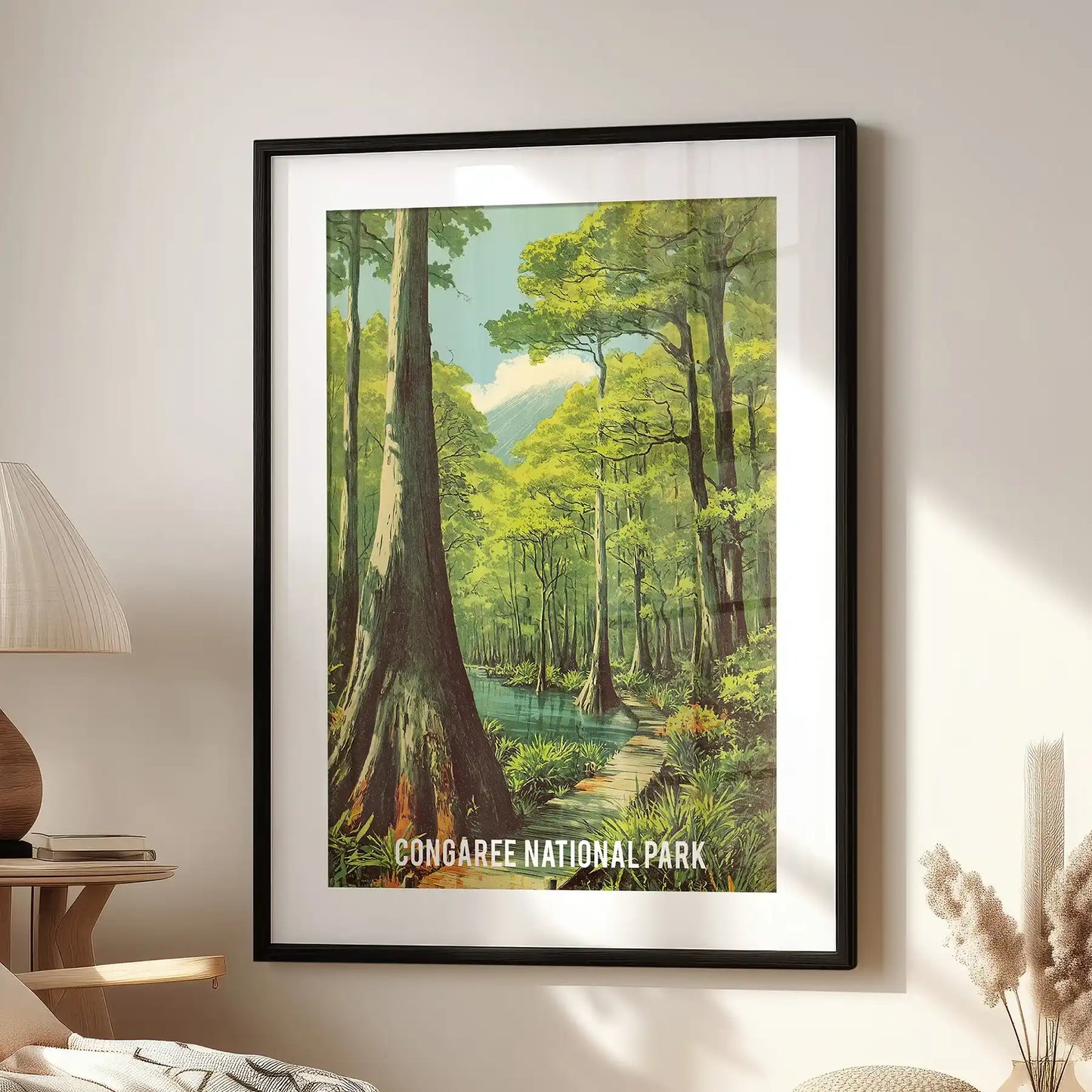 Congaree River scene artwork print, framed in black with a mat, perches over a reading chair in the sitting room, a crisp travel poster vibe for the nook.