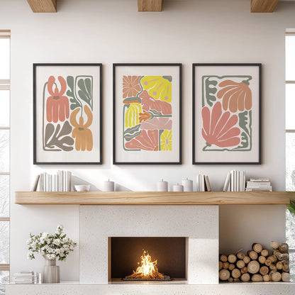 Abstract botanical florals, set of three prints, hang over the lounge mantel in sleek black frames, bringing terracotta tones and soft boho texture to the wall.