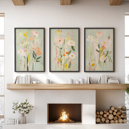 Bright abstract flowers, a 3-piece wall art set, in black frames, styled above the hearth in a cozy lounge.