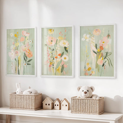 Colorful floral painting, a set of 3 wall art prints, is shown in white frames above the storage bench in the kids playroom.