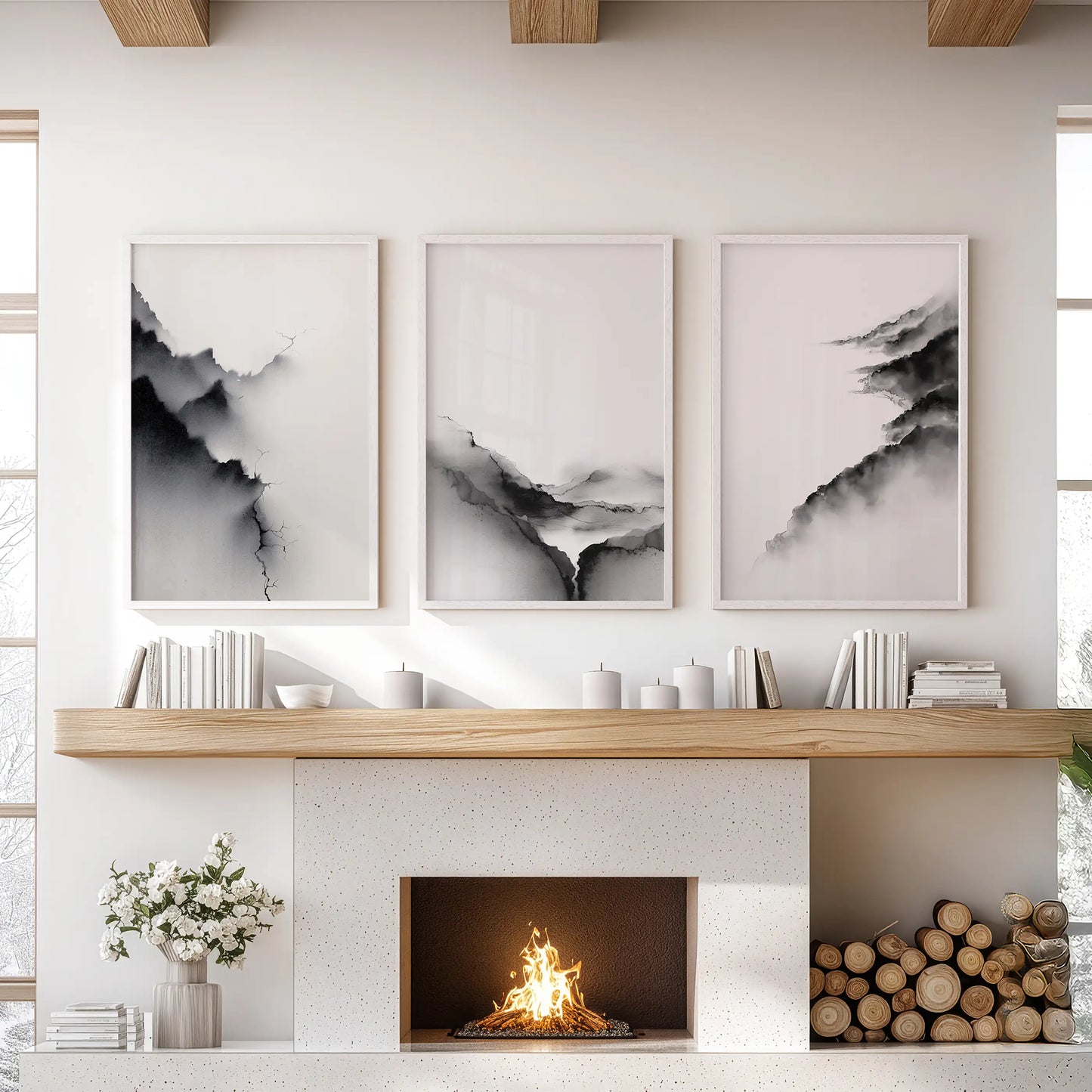 Set of three wall prints showing monochrome abstract scenery keeps the family room balanced over the hearth in white-framed focus.