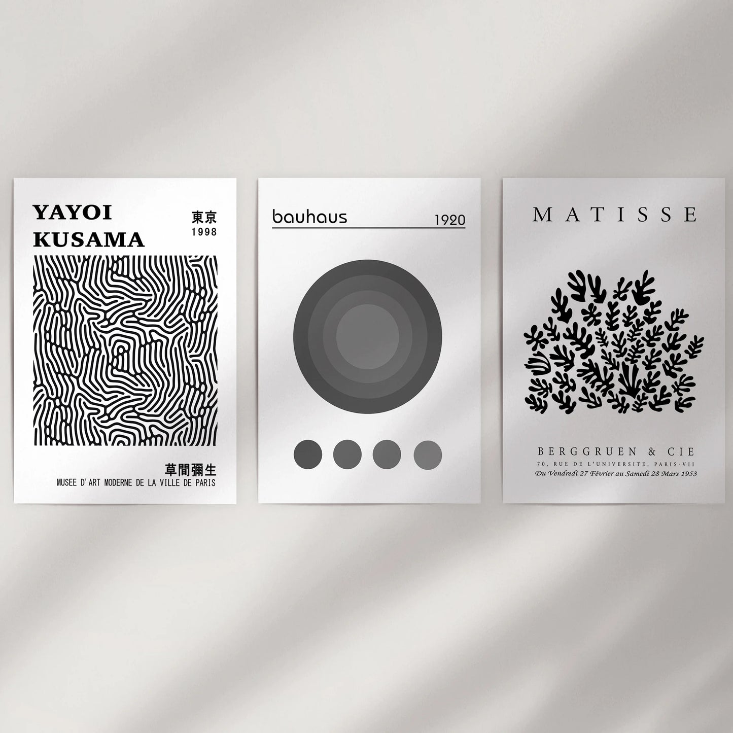 Minimal black-and-white abstracts, set of three, cleanly fill a bare wall space as art prints with a frame-free finish for a crisp, modern display.