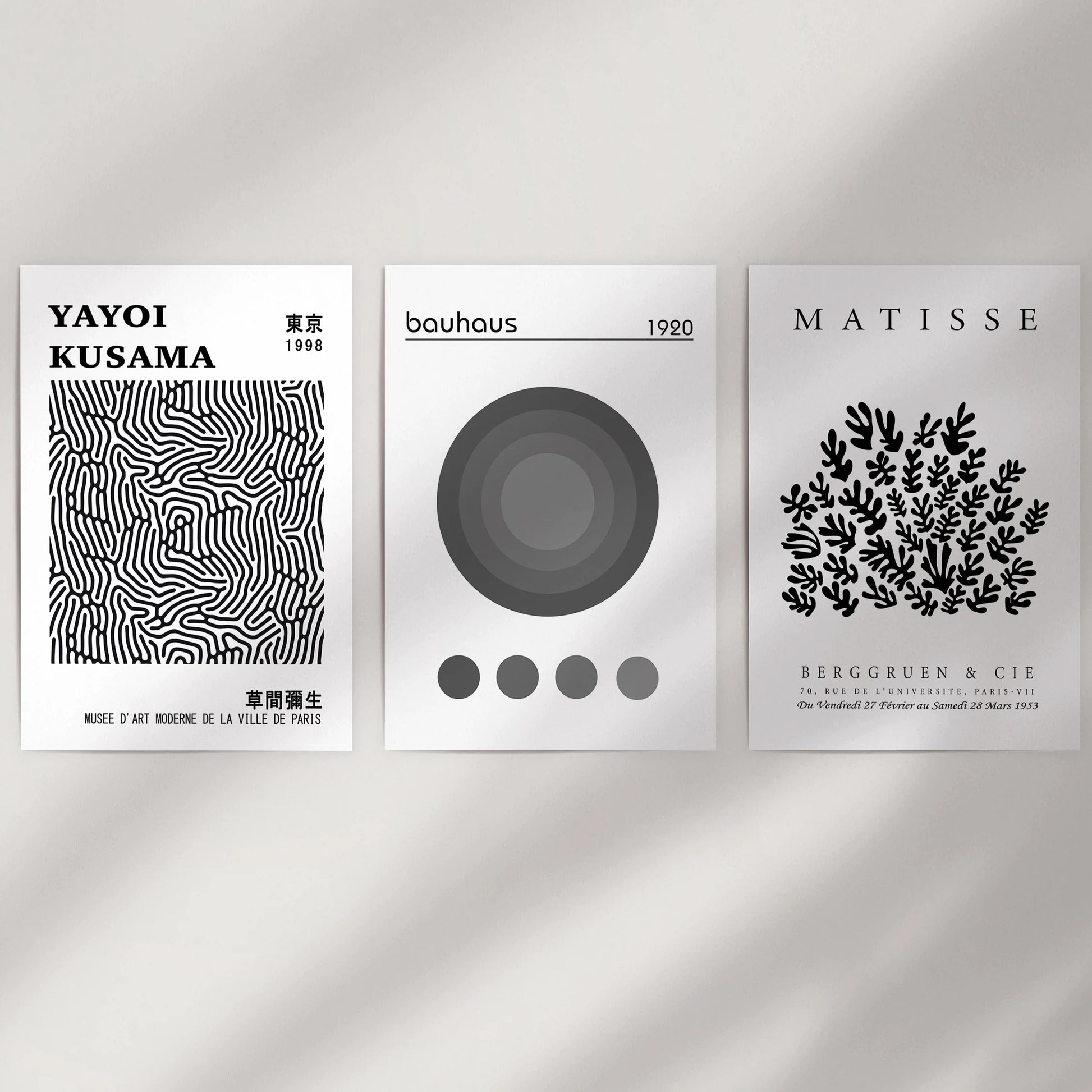 Minimal black-and-white abstracts, set of three, cleanly fill a bare wall space as art prints with a frame-free finish for a crisp, modern display.