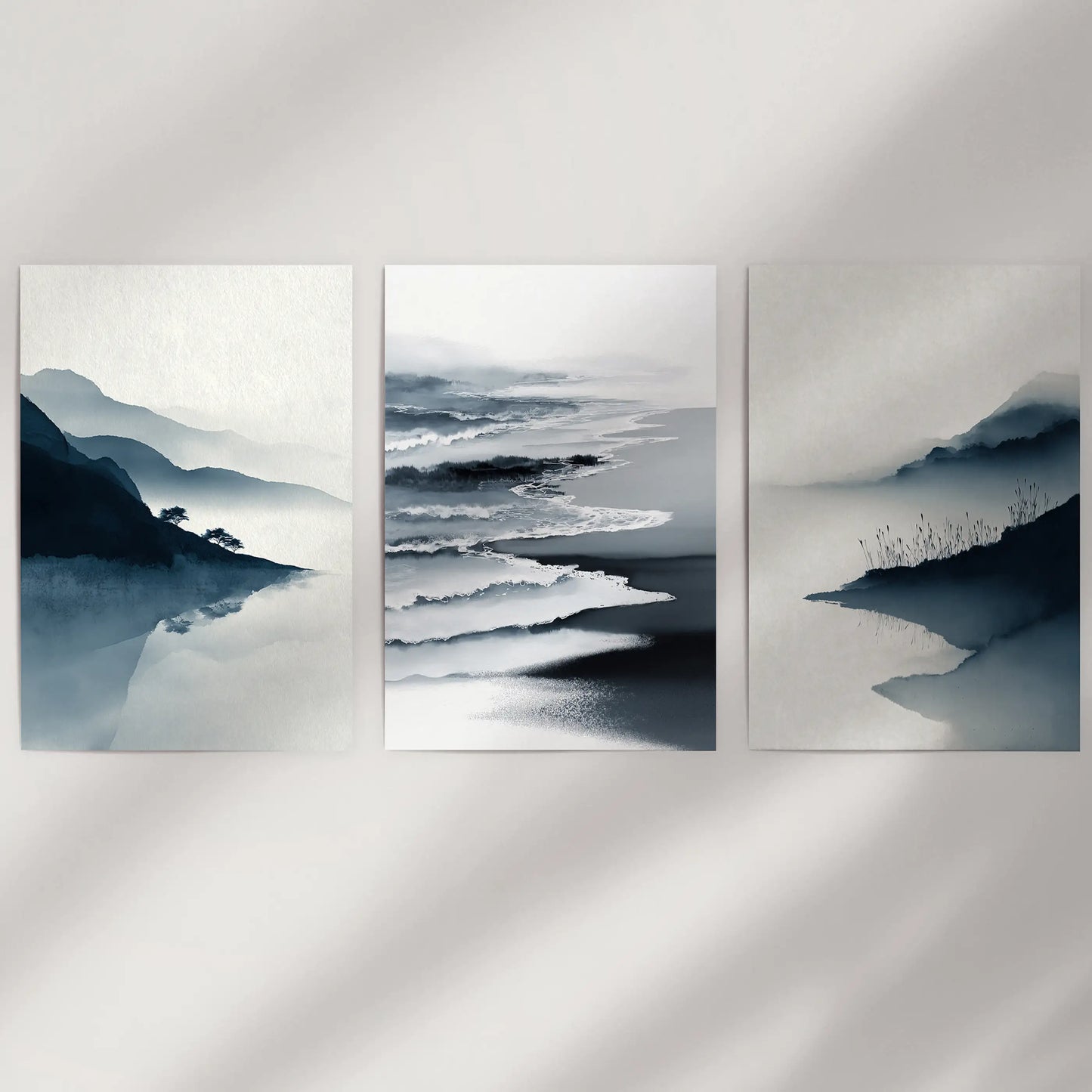 A serene three-print seaside set shows soft blue gradients on a white wall, arriving rolled safely in a protective mailing tube.