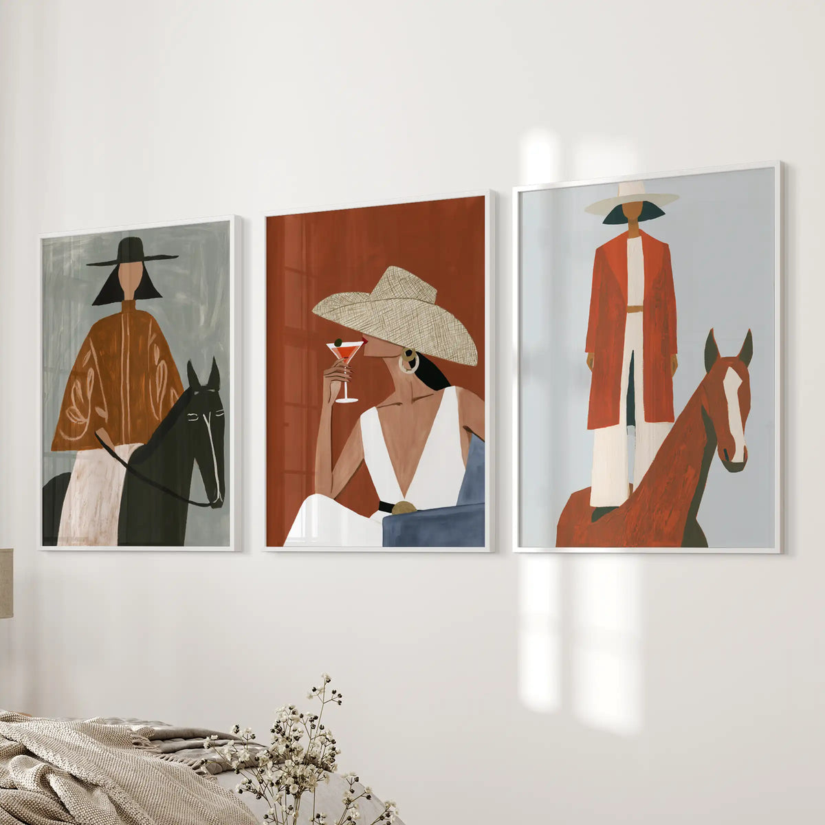 Horse and rider scenes, a set of 3 posters in slim white frames, bring a polished western note near the bedroom bed wall.