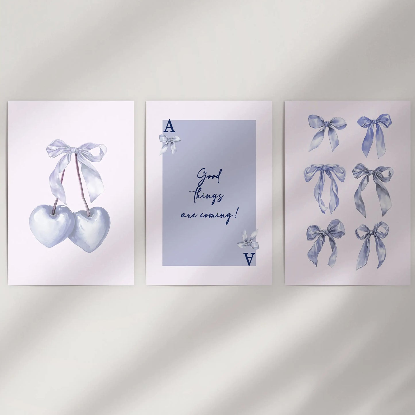 Light blue bow aesthetic posters, 3-piece collection, arrive frame-free to refresh a blank wall with a delicate coquette vibe and softly balanced spacing.