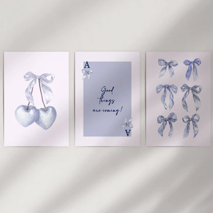 Light blue bow aesthetic posters, 3-piece collection, arrive frame-free to refresh a blank wall with a delicate coquette vibe and softly balanced spacing.