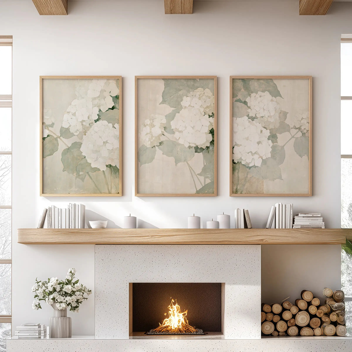 Neutral hydrangea blooms feature in a three-piece wall hanging set with oak-framed prints above a sitting room fireplace.