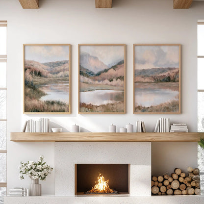 Water reflections with shoreline trees, a set of three art prints in thin wood frames, lives over the fireplace mantel in the lounge and warms the space with nature.