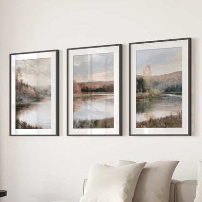 Lakeside forest scenes in a three-print wall art set, black framed with mats, span over the living room sectional for a calm, cottage focal point.