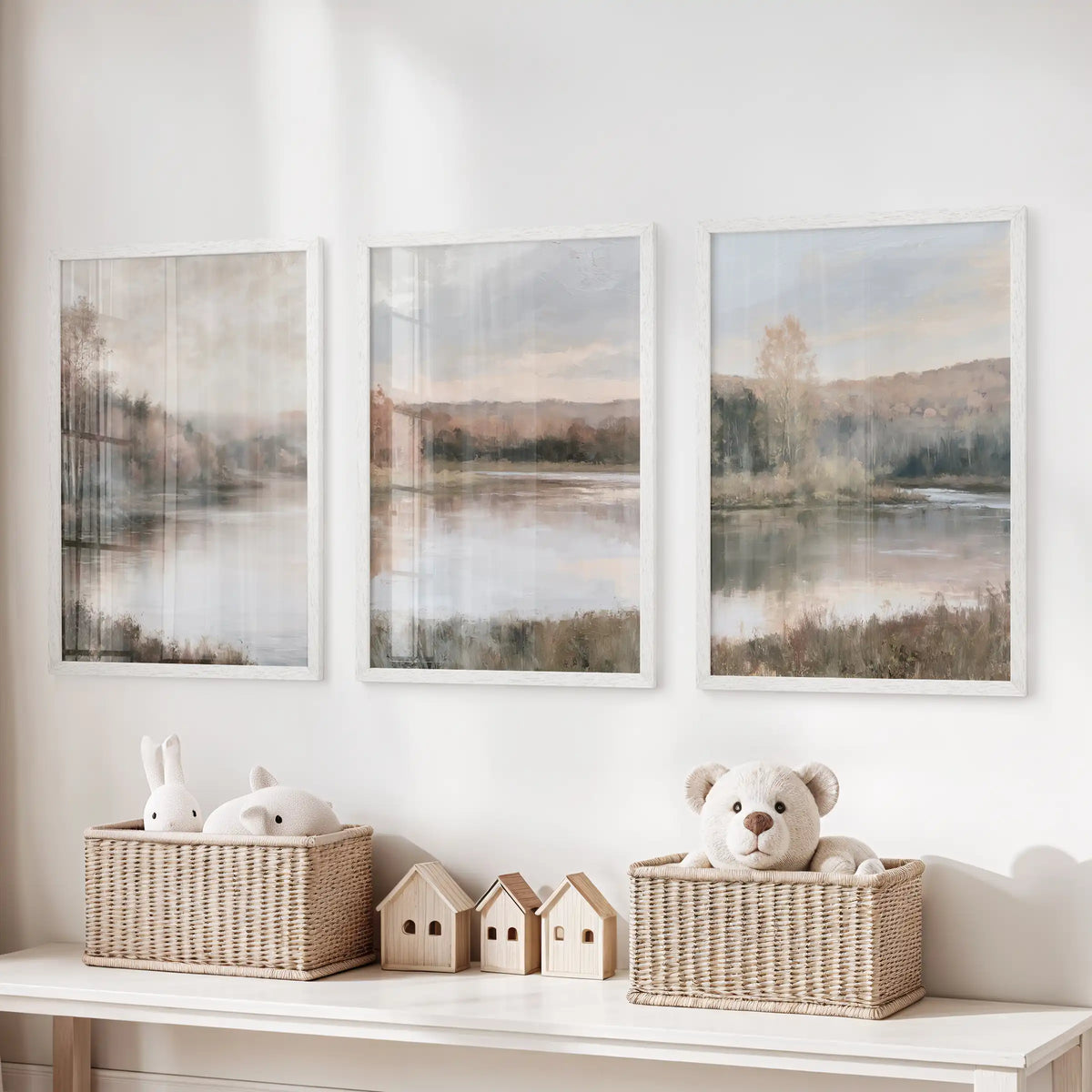 A trio of wall decor pieces with soft impressionist fall vistas floats above the playroom toy organizer in slim white frames, adding calm color.