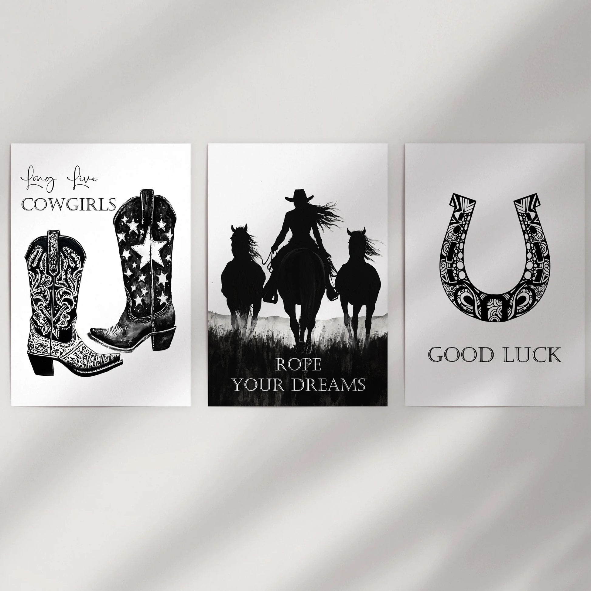 A set of three unframed Texas-inspired graphic prints lines a plain wall, their bold designs adding clean Southwestern edge to the decor.