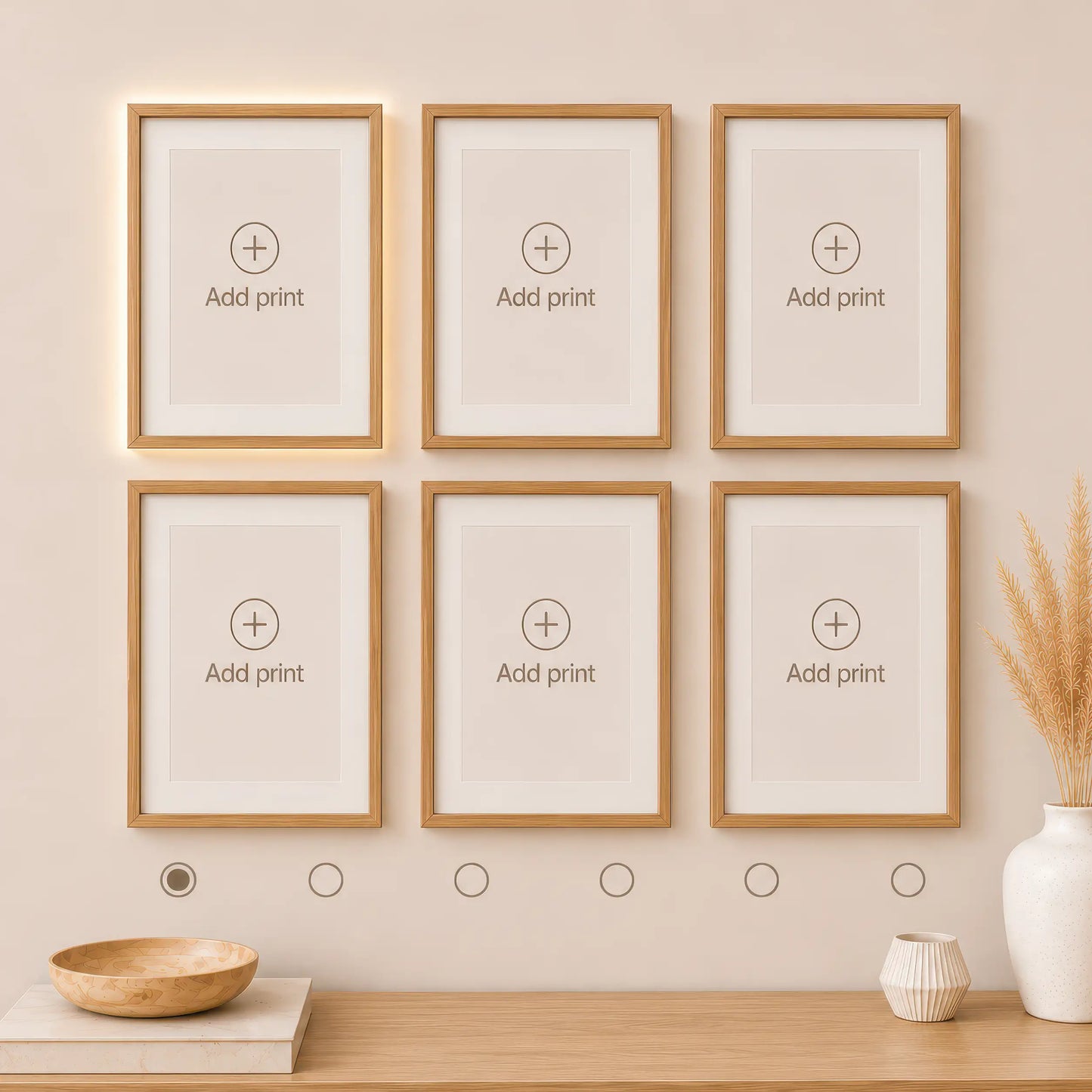 Interactive wall art builder with six empty natural wood frames displayed in two rows of three. Preview and create a personalized gallery wall with matching art prints.