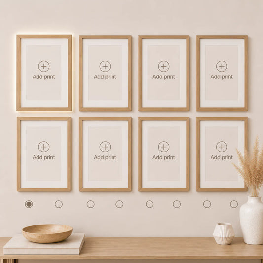 Wall art set builder featuring eight empty natural wood frames arranged in two rows of four. Design a custom gallery wall by choosing and arranging your favorite prints.