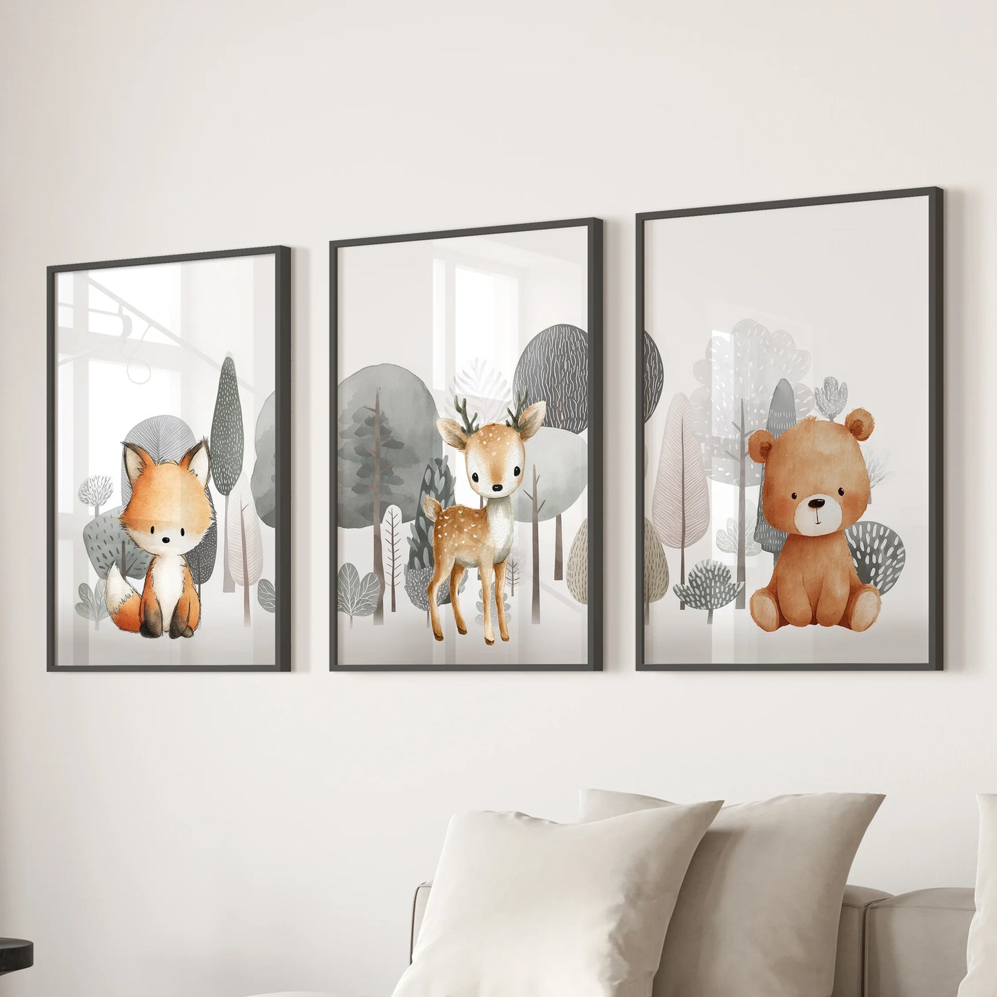 A trio of framed wall prints-fox, fawn, and teddy bear portraits in black frames-adds a soft woodland touch above the lounge sofa.
