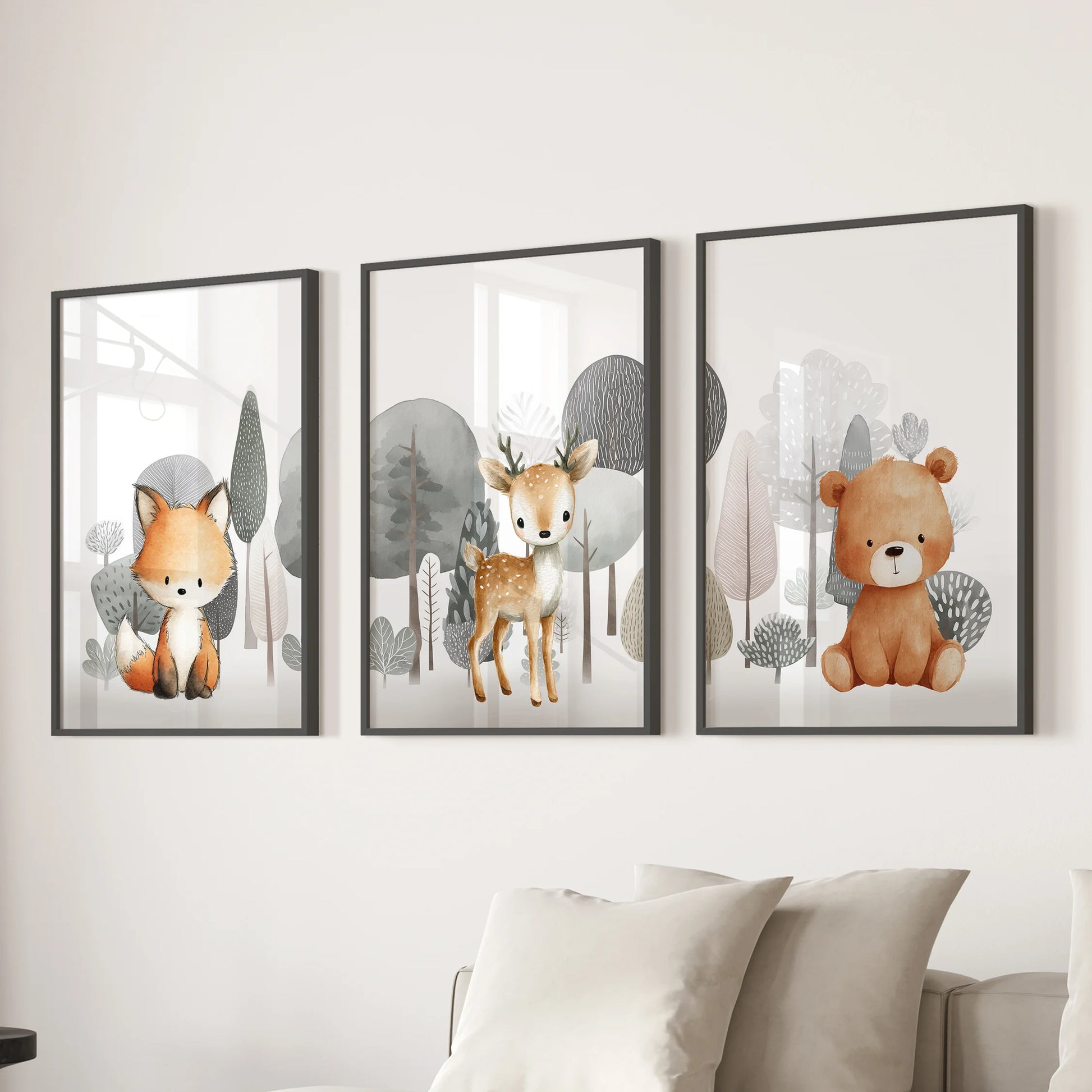 A trio of framed wall prints-fox, fawn, and teddy bear portraits in black frames-adds a soft woodland touch above the lounge sofa.