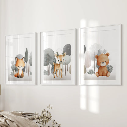 A matted trio of fox, fawn, and teddy bear prints, framed in white, rests neatly on the bedroom's bedside wall.
