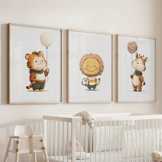 Lion cub, tiger cub, and giraffe calf three-print gallery wall hangs above the cot in an infant room, set in solid oak frames for a cozy feel.