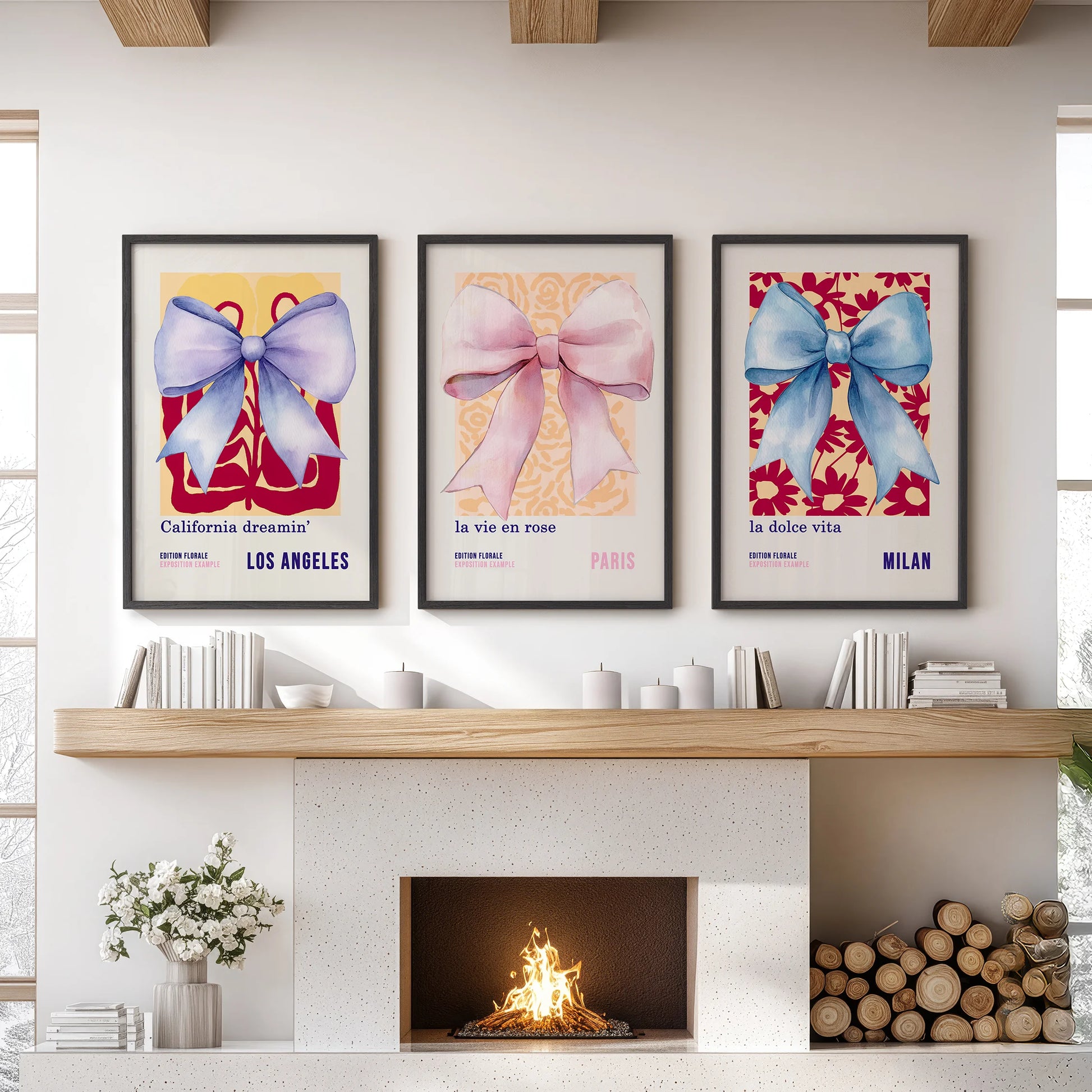Blue and pink ribbon bows, set of 3 wall art prints in black frames, create a playful focal point above the family room mantel.
