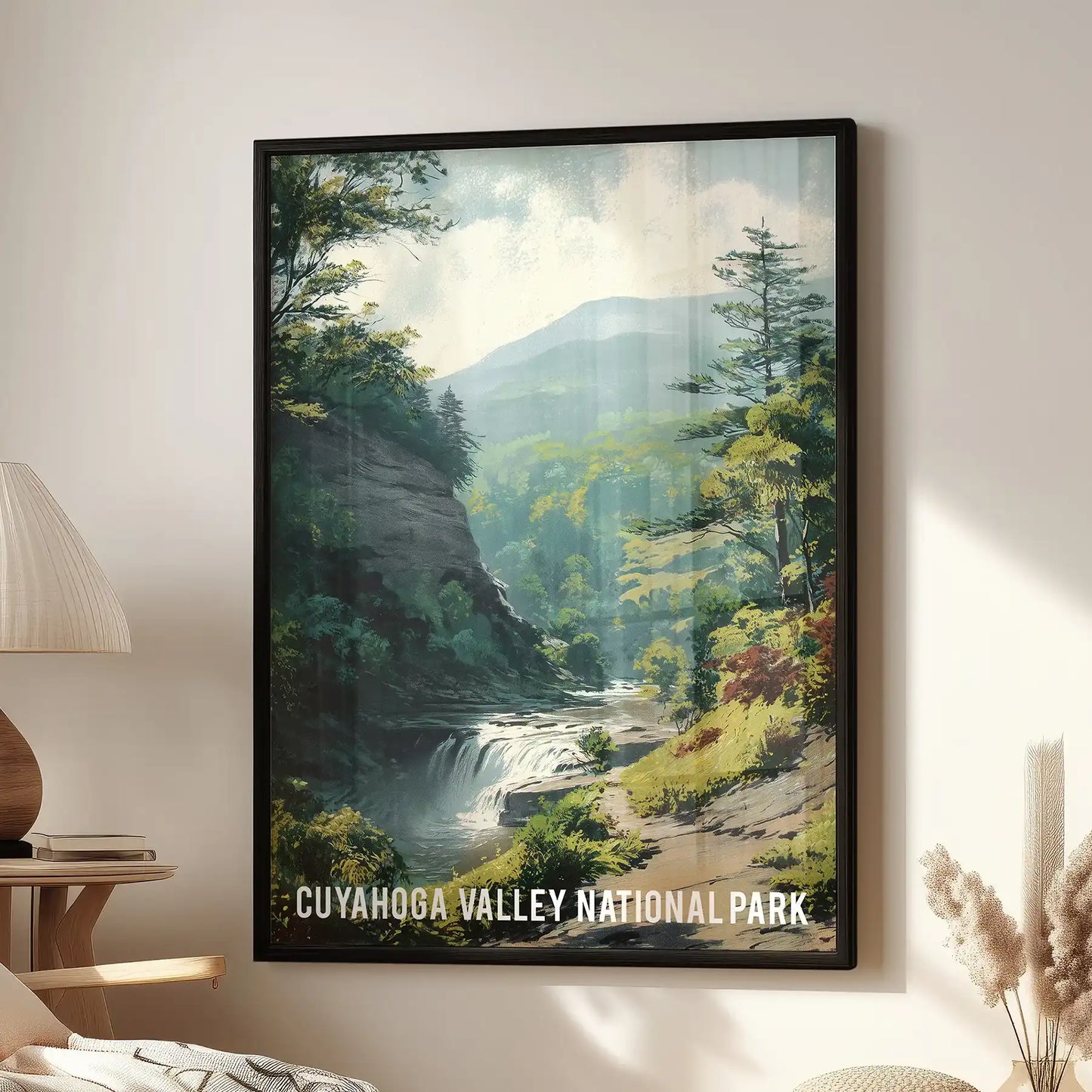 A single landscape wall art piece of Cuyahoga Valley in a sleek black frame hangs above the family room sofa, rich with green valley views.