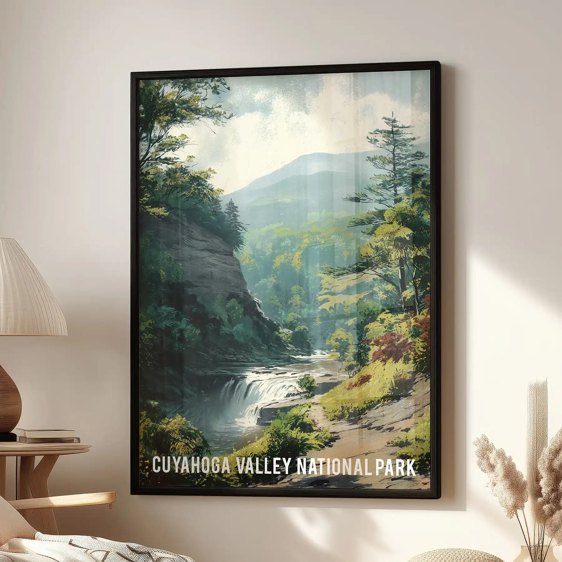 A single landscape wall art piece of Cuyahoga Valley in a sleek black frame hangs above the family room sofa, rich with green valley views.