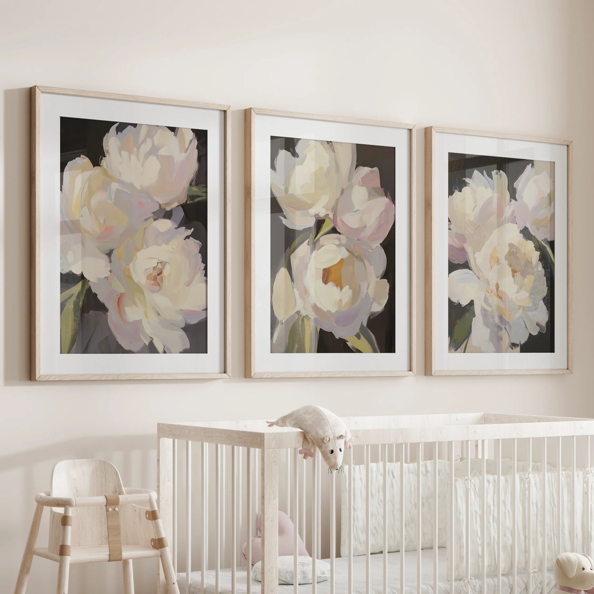 Pink and white peonies, a 3-pc wall art set, nestle above the nursery bassinet in oak frames with mats, a tender vintage touch for quiet hours.