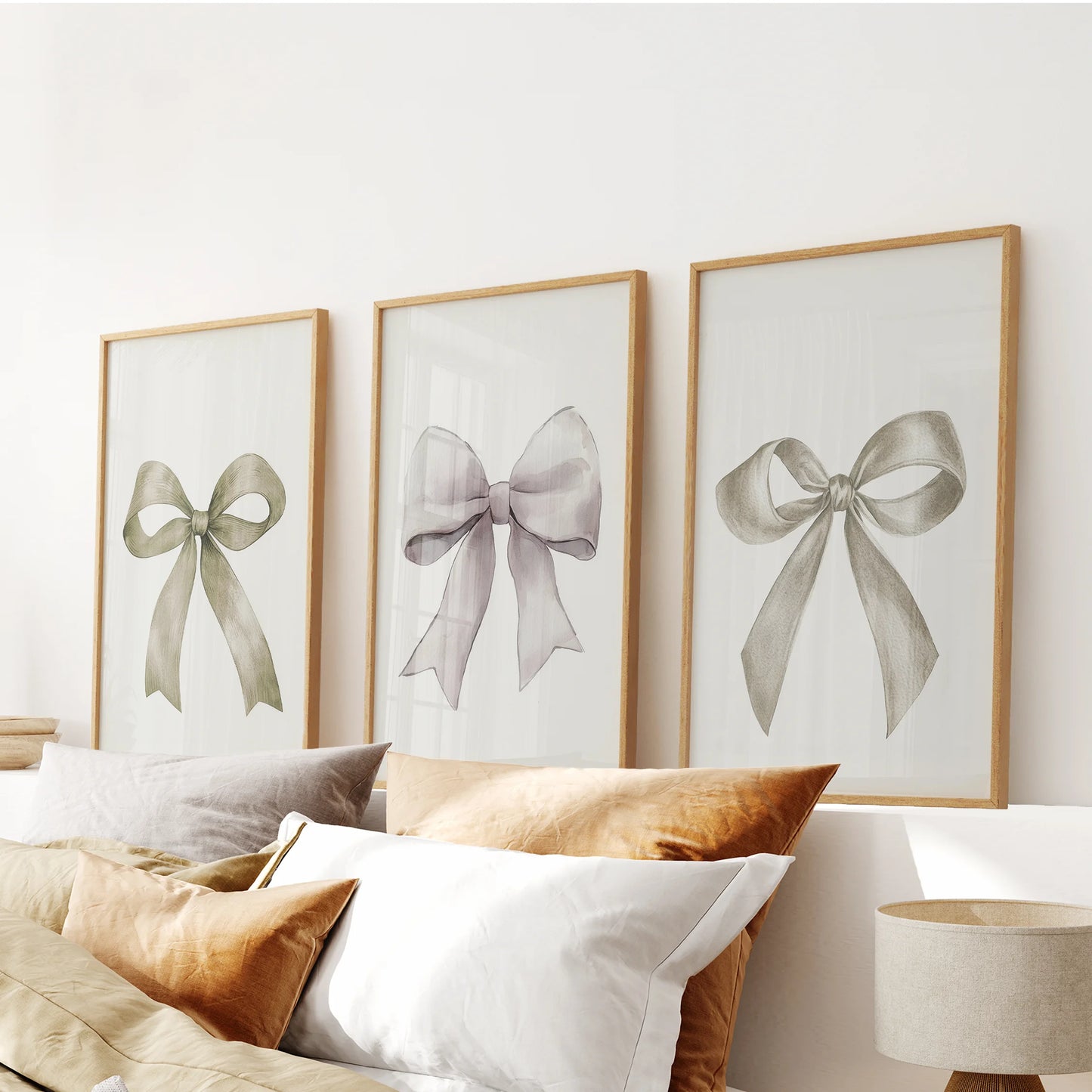 Minimalist ribbon art, a 3-piece wall art set, crowns the headboard area in warm wooden frames, pairing creamy bows with natural texture for a cozy finish.