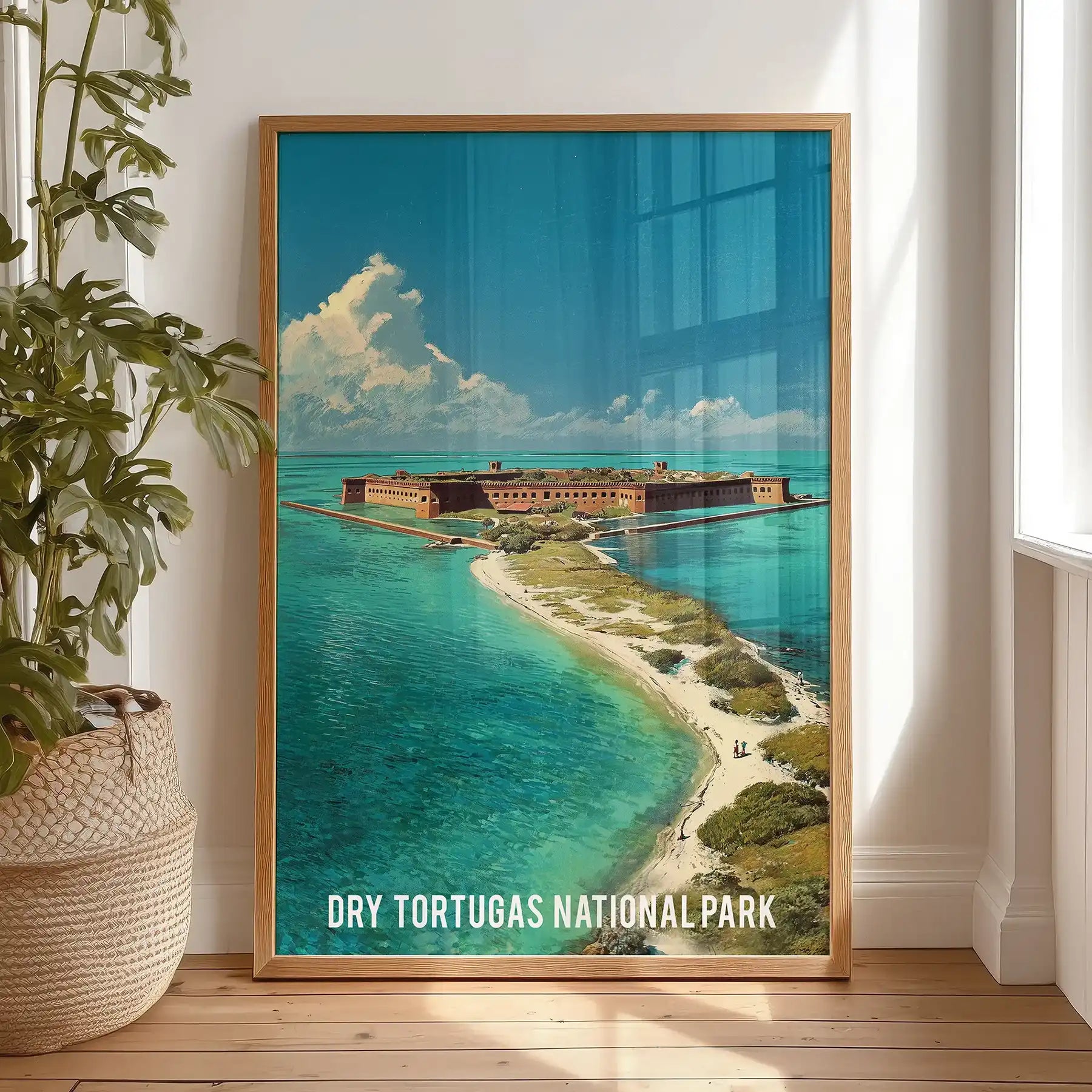A standalone art print of the coastal Florida Keys, in warm oak wood, rests against the bedroom wall, adding natural calm and texture.