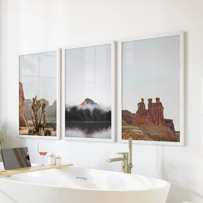 Boho desert scenery wall art print trio set in crisp white frames turns the bathroom into a serene retreat, displayed over the freestanding tub.