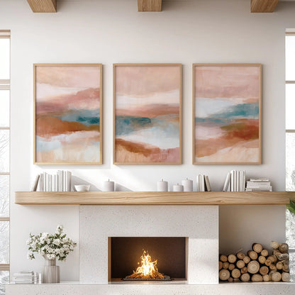Blush pink, terracotta and blue color fields, a gallery wall set of three in light wood frames, gather above the hearth to warm the lounge.