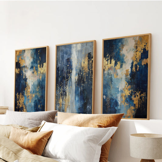Three oak-framed wall panels featuring blue and gold textures hover above the bedroom headboard, giving the space a tailored, rich finish.