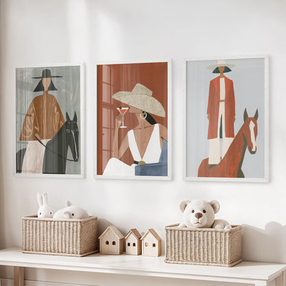 Cowgirl fashion silhouettes, a print trio set in white frames, perk up the kids' room over the storage bench with lighthearted ranch style.