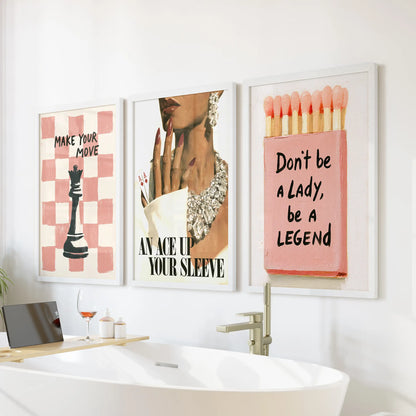Pink feminine three-piece wall art set in white frames, positioned over the bathtub in a bathroom.