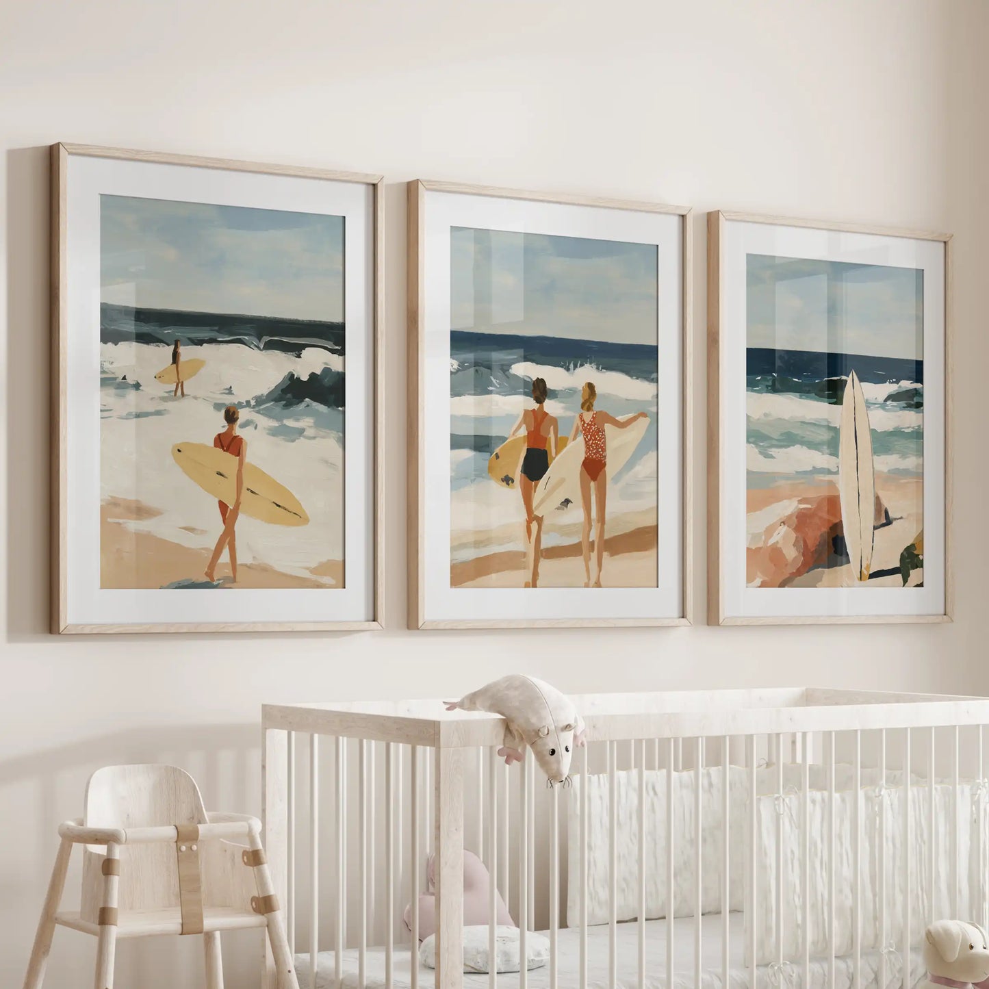 Surfer girl wall art set of 3 decor, in wooden frames with matting, settles gently above the bassinet to give an infant room a calm ocean whisper.