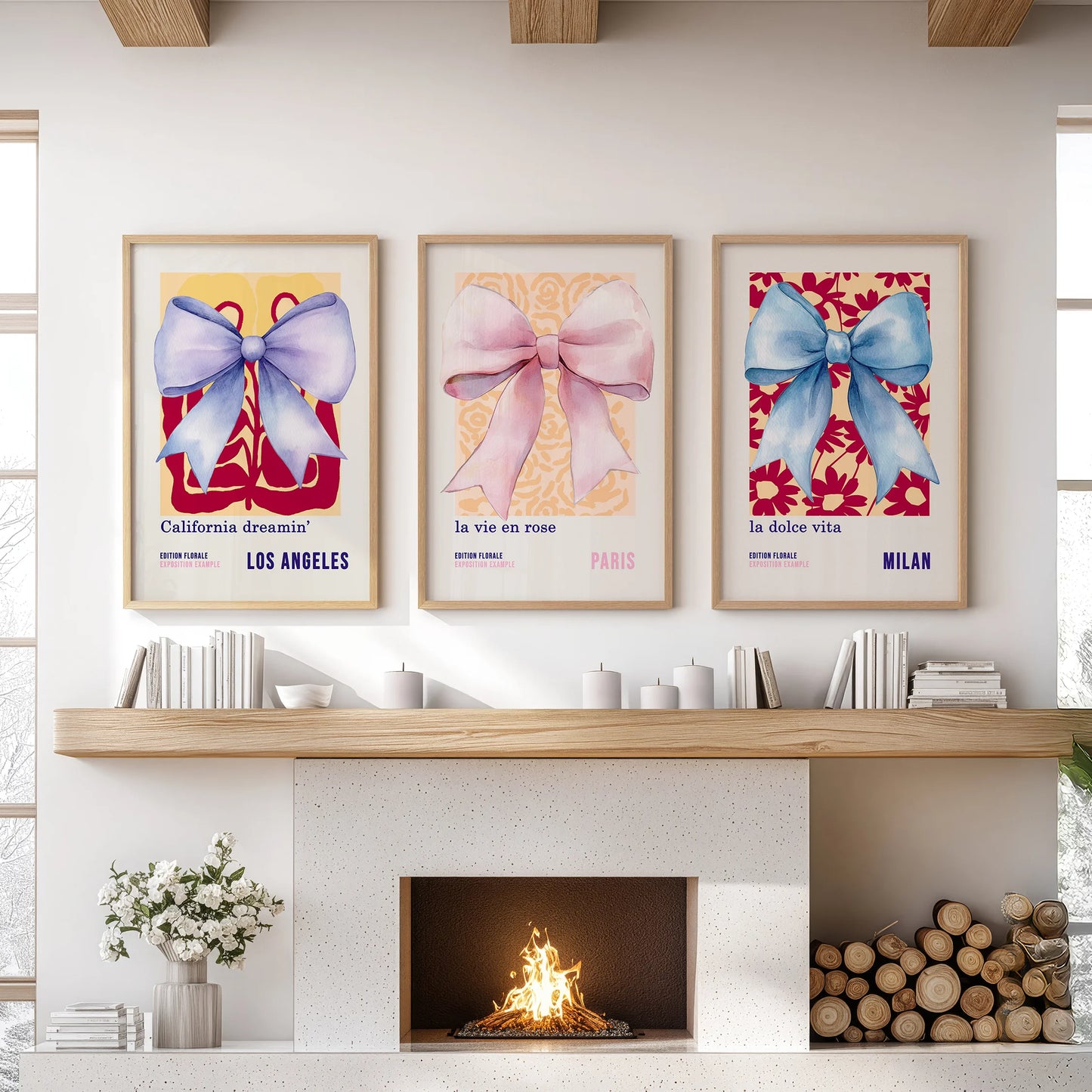 A 3-piece wall art set of blue and pink bows in light oak frames rests above the living room mantel, adding warm, tailored polish.