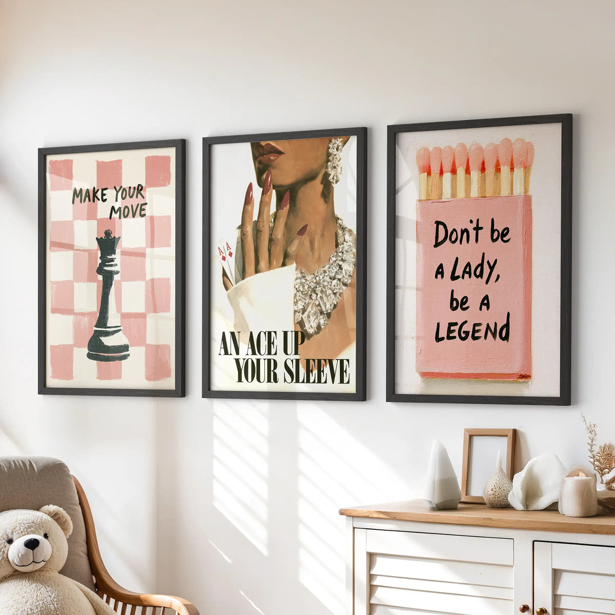Motivational quote poster set of three in black frames, displayed above a dresser in a kids room.
