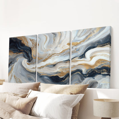 Navy blue brush stroke abstracts in a three-piece canvas wall art set crown the bedroom, centered above the headboard for a crisp, modern finish.