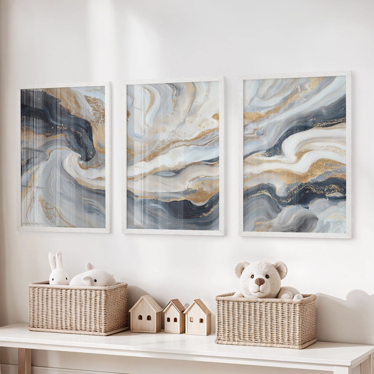 Three white-framed wall art pieces of dark blue brushwork add playful calm above the toy storage bench in the kids’ playroom.