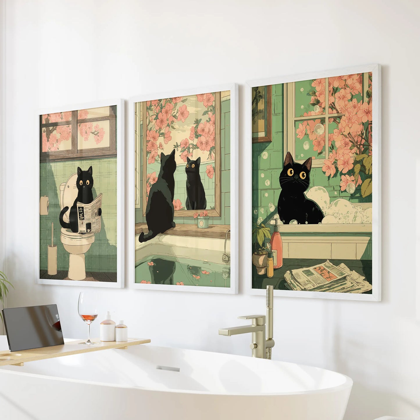 Set of three white-framed wall prints show a Japanese black cat reading a newspaper, hanging neatly above the bathtub for a fun bathroom accent.