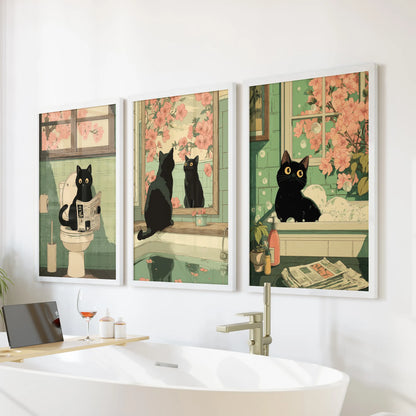 Set of three white-framed wall prints show a Japanese black cat reading a newspaper, hanging neatly above the bathtub for a fun bathroom accent.