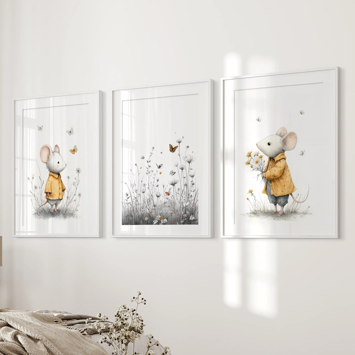 Boho mouse nursery prints, a wall art set of three in white frames with matting, mounted on the bedroom wall beside the bed for a calm, curated look.
