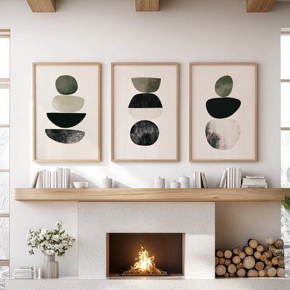 Mid-century abstract forms set of 3 artwork prints in natural wood frames dress the sitting room, mounted above the mantle for timeless appeal.