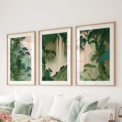 Japanese forest wall art set of three matted prints in thin wood frames, displayed above a couch in a family room.