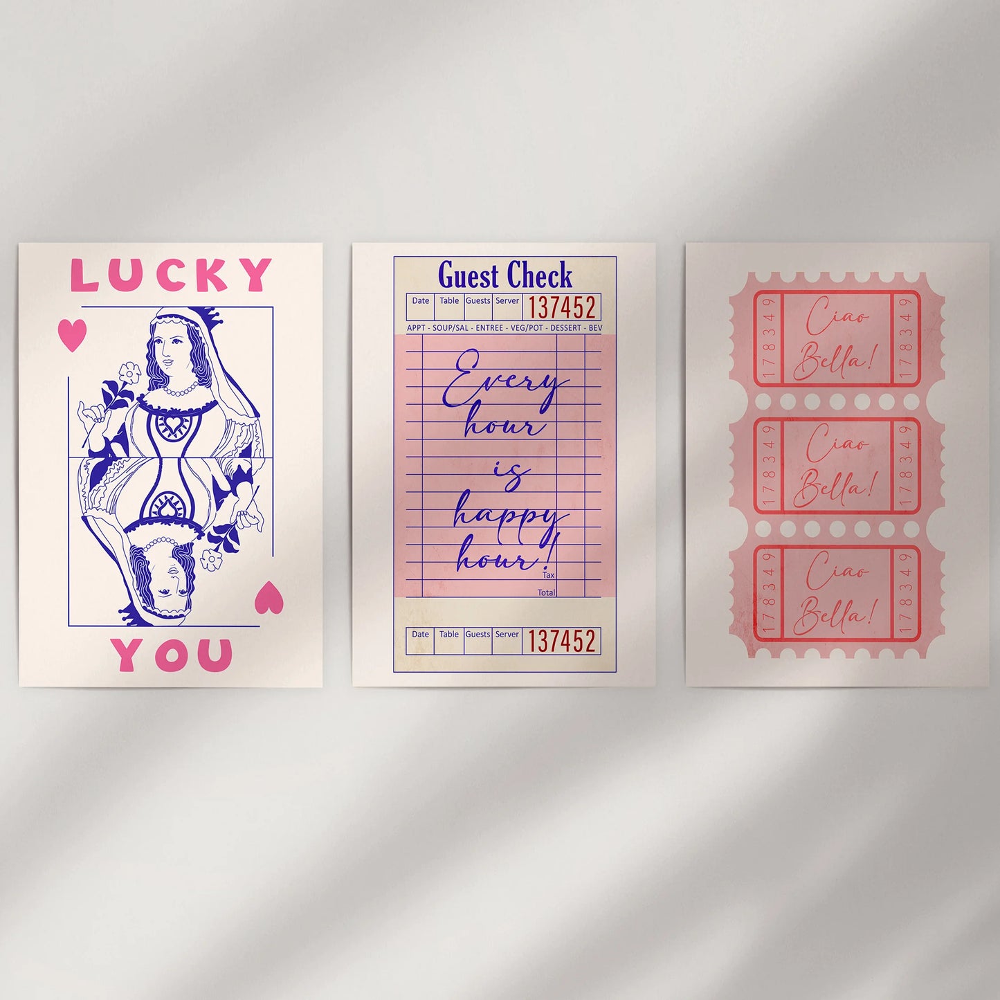 A print-only trio featuring guest check, ticket stub, and playing card motifs refreshes an empty wall with punchy pink charm.