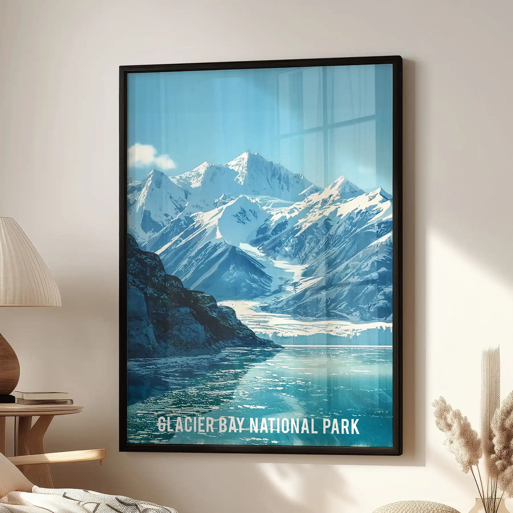 Glacier Bay National Park scene wall art brings icy peaks to life, displayed in a sitting room beside a reading chair in a sleek black frame.