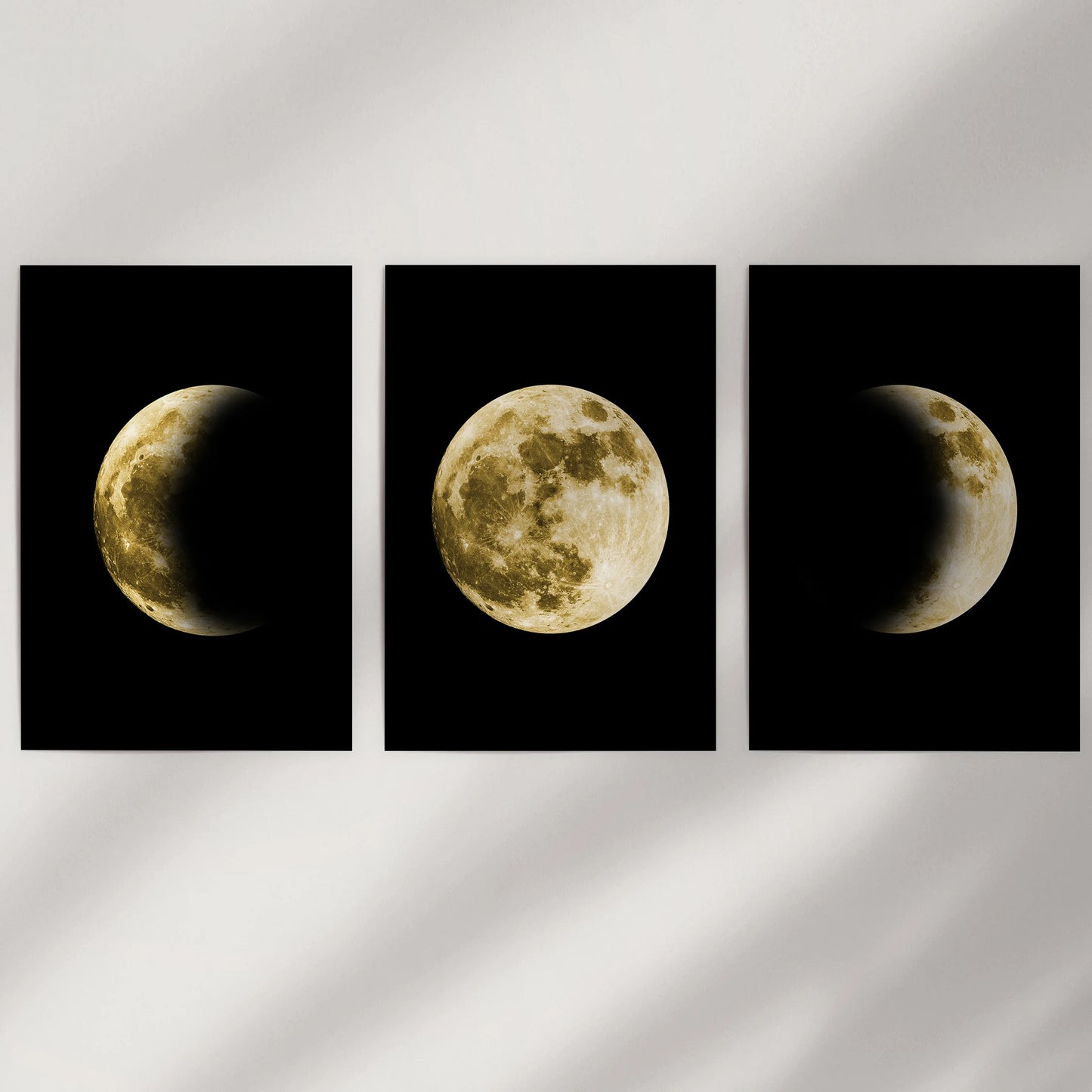 A trio of unframed lunar phase art prints ships rolled in a tube, ready to form a gleaming moon triptych against any blank wall.